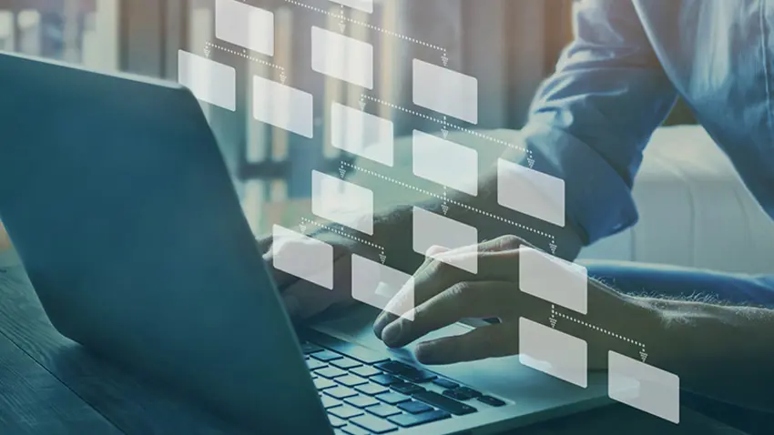 Person using their laptop to view the program topics and structures