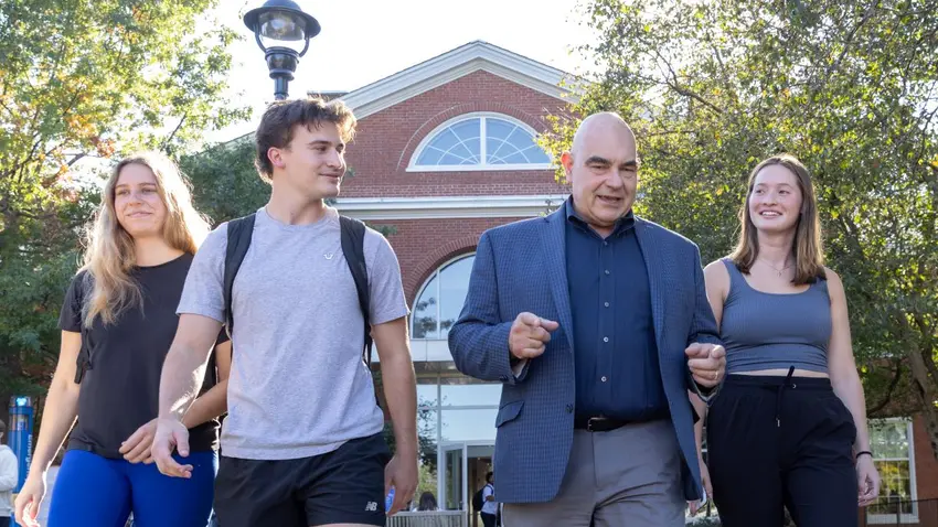 James “Pouli” Pouliopoulos walking and talking with Bentley students