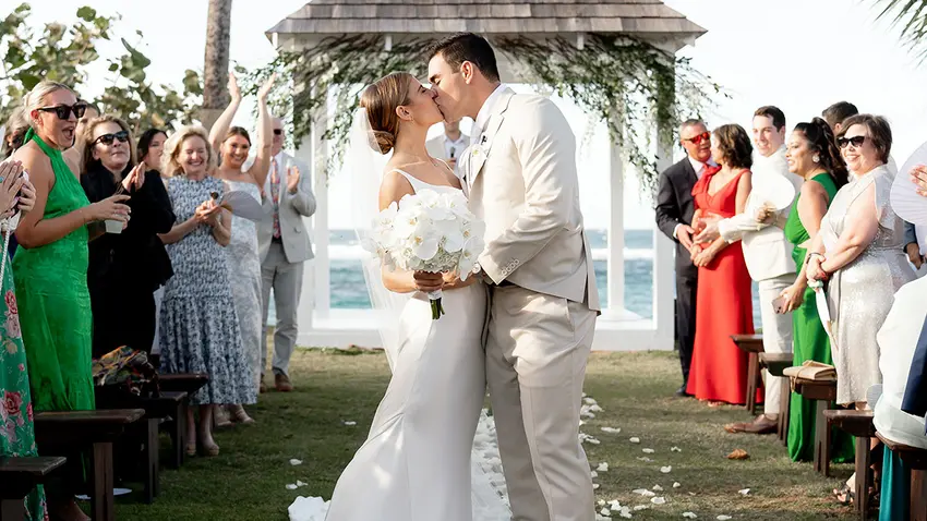 a bride and groom at an outdoor altar