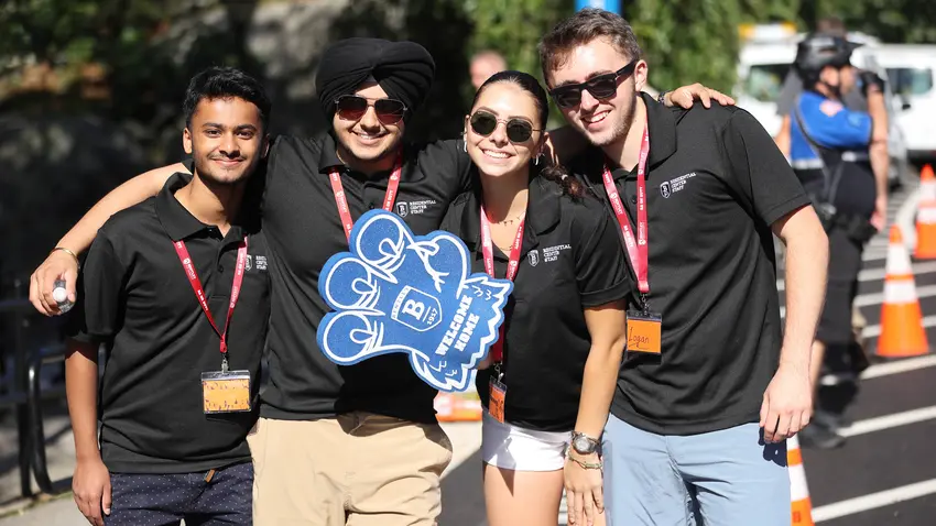 Four Bentley students greet new Falcons and their families on Move-In Day 2023.