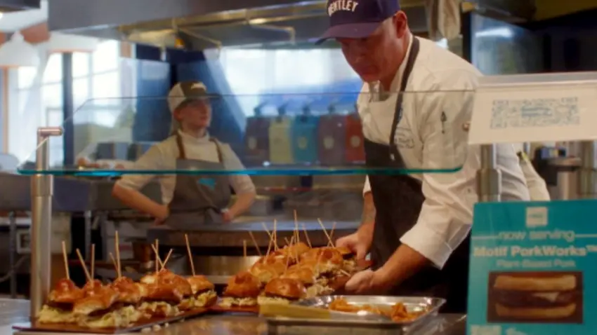 Bentley chef with tray of food