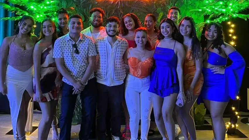 Thirteen members of La Cultura Latina's executive board pose for a picture during their La Raza event.