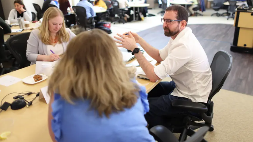 Mini-MBA students discussing at learning pod