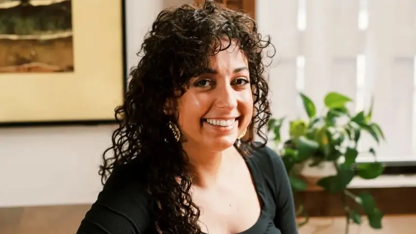 Kimberly Down wears a black shirt and smiles for the camera