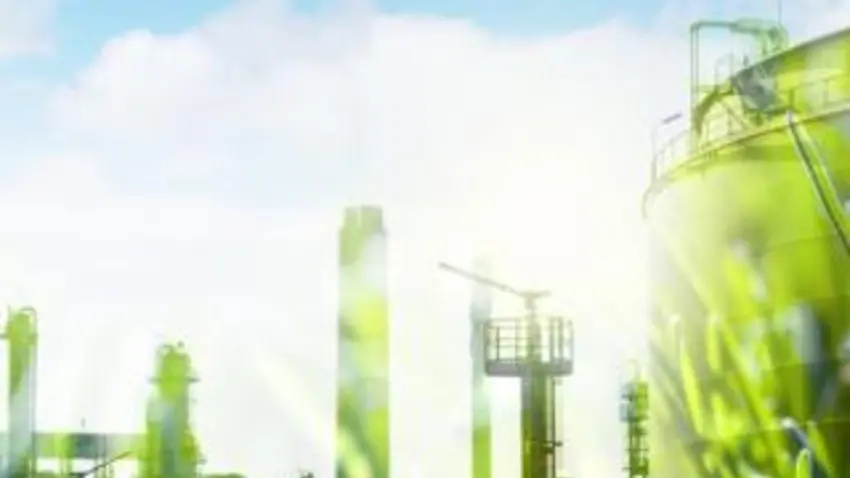 image of a skyline and businesses with green grass and blue sky