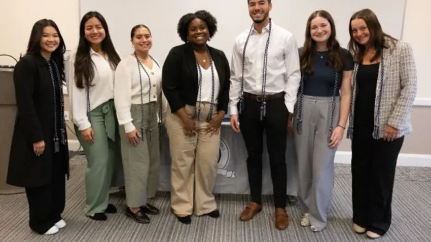 Seven new inductees to Bentley's Tri Alpha honor society that recognizes academic excellence among first-generation college students.