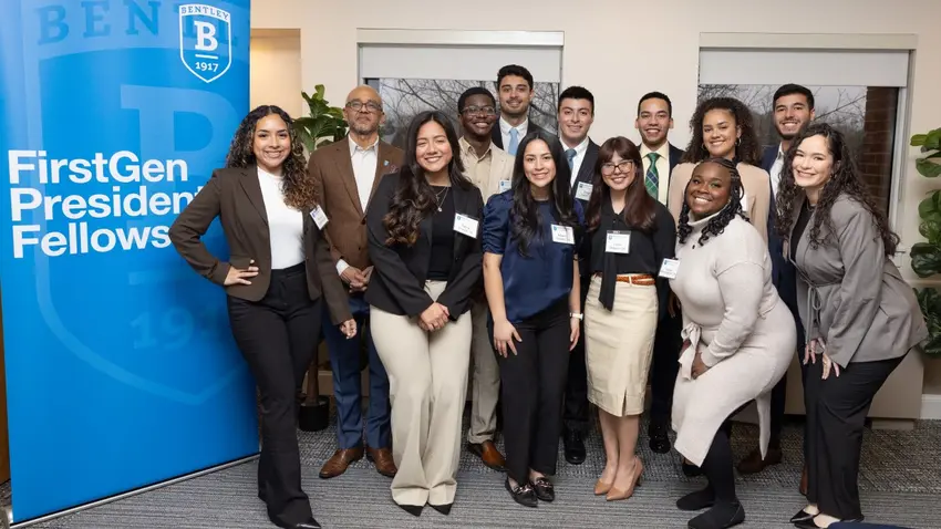 Members of the first graduating class of FirstGen Presidential Fellows pose with Bentley President E. LaBrent Chrite.