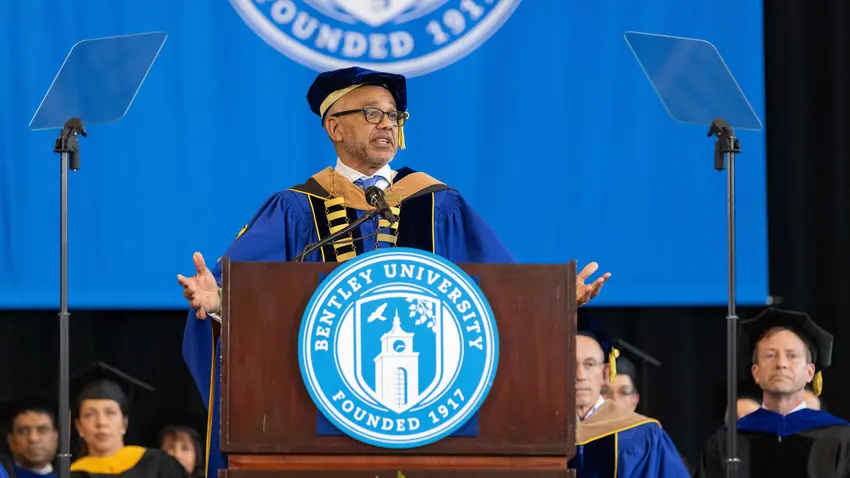 President Chrite delivers the commencement address from behind the podium