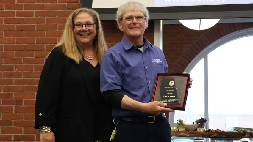 John Noel poses with BSLCE Staff of the Year Award