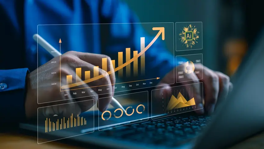 Close up of man's hands typing on laptop computer keyboard with a gold image overlaid that shows bar graphs, pie charts and AI logos.