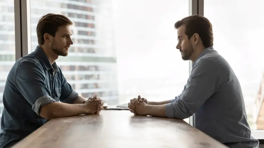 Two Business professionals talking through a disagreement