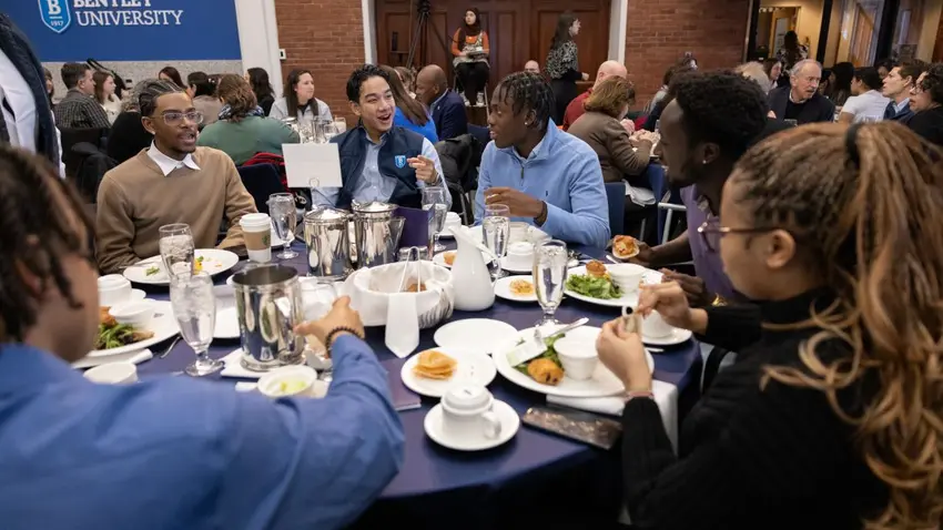  Attendees networking during breakfast at the annual Bentley University MLK social justice program  