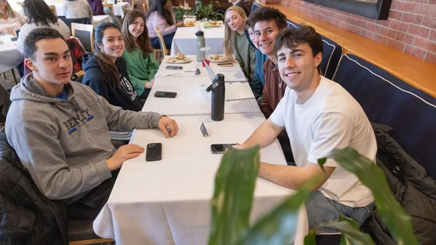 Attendees networking during lunch at the annual Bentley University MLK social justice program  