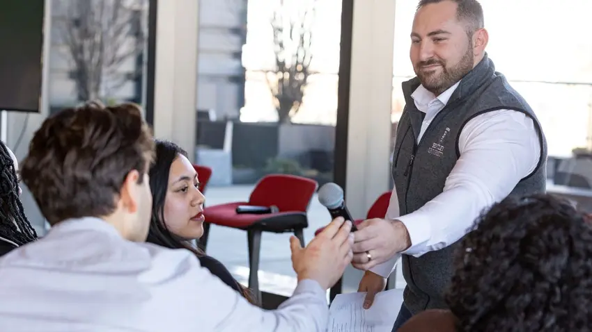 Bentley Office of Undergraduate Admission representative engages with students at Celtics Career Day