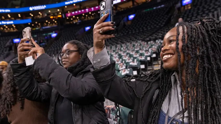 Students take photos at Celtics Career Day presented by Bentley University