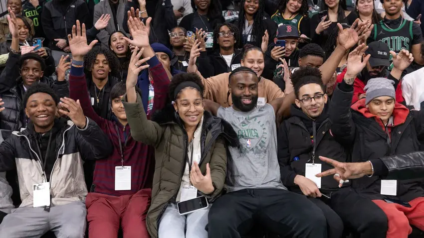 Boston Celtics All-Star wing Jaylen Brown poses with students at Celtics Career Day presented by Bentley University