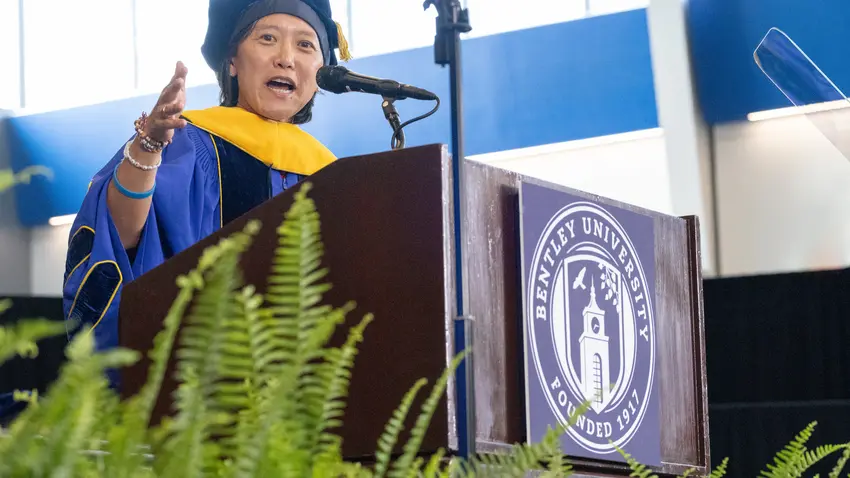 Yvonne Hao delivers graduate commencement address at lectern