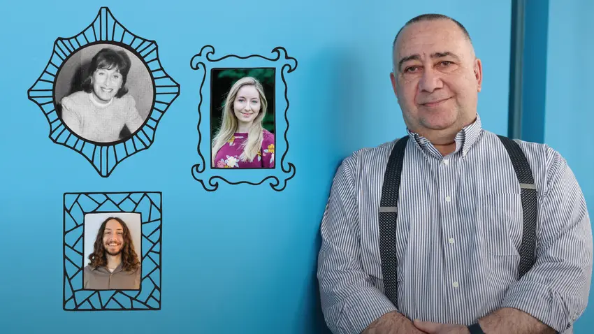 a man posing by photos of his family