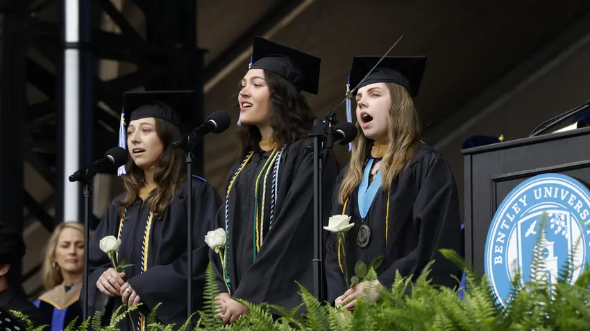 Student group sings "America, the beautiful" at the start of the undergraduate commencement ceremony