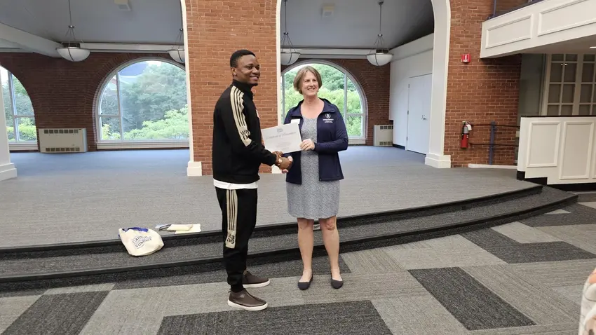 A winner receiving their prize.