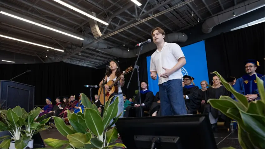 Bentley students perform "Unwritten" during convocation for the Class of 2029