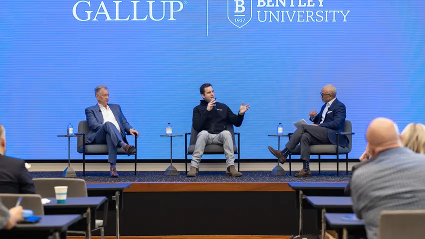 Bentley President E. LaBrent Chrite on stage at a 2025 Bentley-Gallup event in DC with Guardian Bikes Founder and CEO Brian Riley and Dennis Rodenbaugh, president and CEO of Dairy Farmers of America