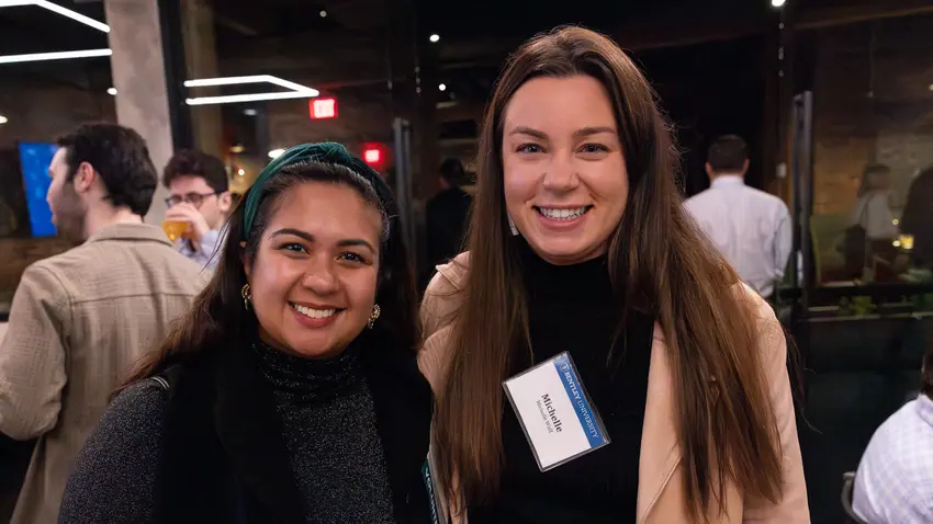 alumni smile at the Boston Holiday party
