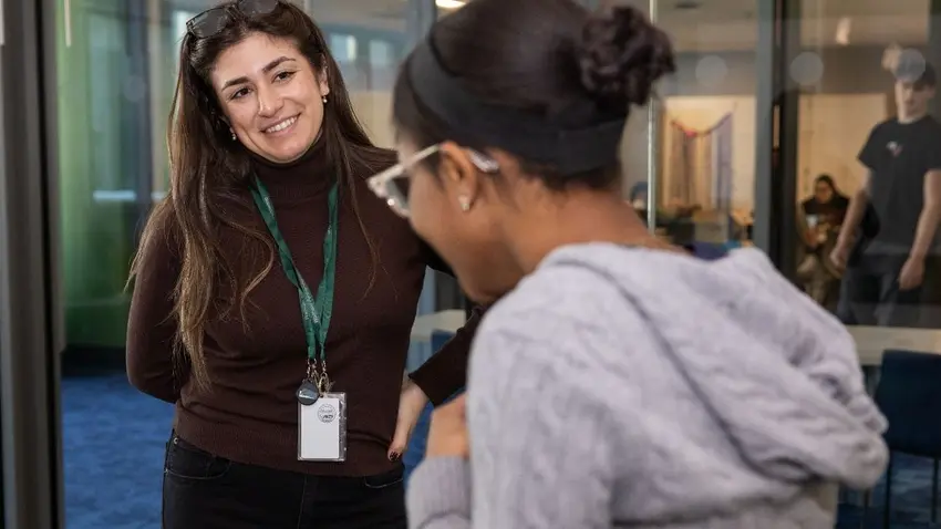 Monica Manna ’23 (left) mentors a Waltham High School student as part of a Waltham Partnership for Youth internship program.