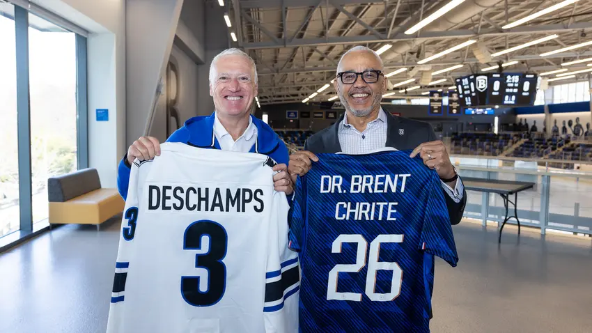 Didier Deschamps — manager of French national football team, l’équipe de France de football — and Bentley President E. LaBrent Chrite hold team jerseys