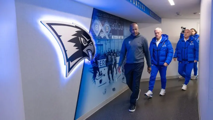 Didier Deschamps, manager of the French national football team, and Bentley Director of Athletics Vaughn Williams along with additional team staff