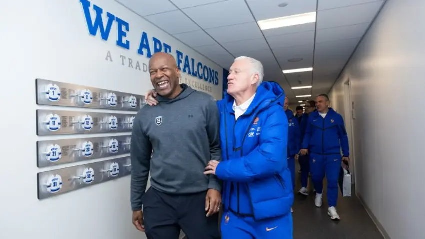 Didier Deschamps, manager of the French national football team, and Bentley Director of Athletics Vaughn Williams along with additional team staff