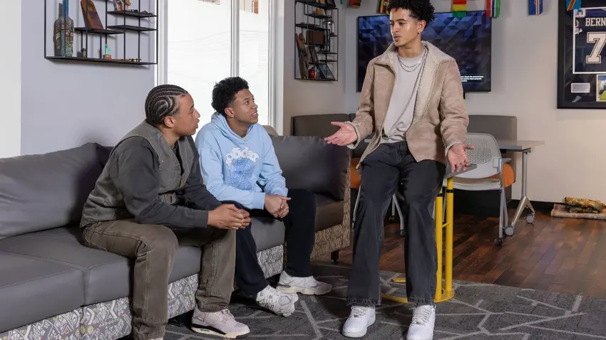 Kevin Aprea Cabrera '26 talks with Markus Facey-Castillo '27 and Emilio Jose Silva-Rosa '29