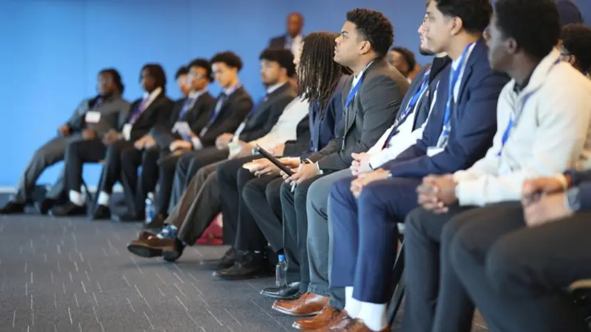 Attendees listen to a panel at the Bentley Mankind Movement annual networking conference