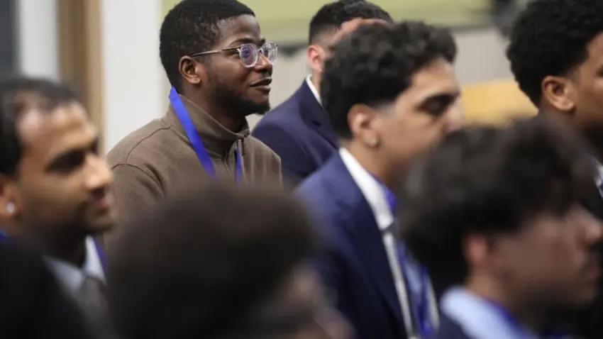 Close up of attendees listening to a panel discussion at the Bentley Mankind Movement networking conference