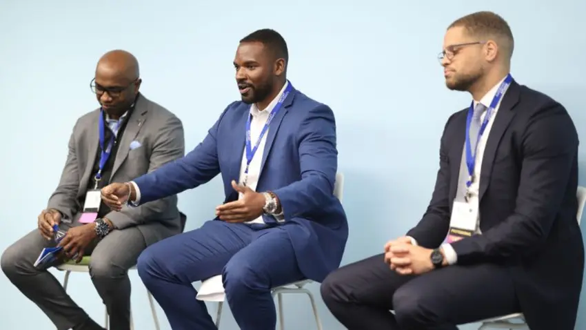 Three panelists speaking at the Bentley Mankind Movement Networking Conference