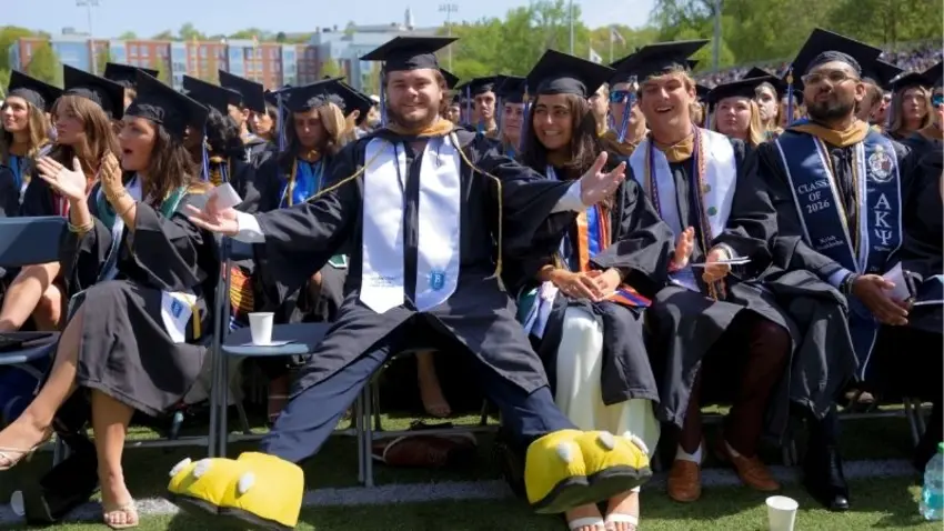 Bentley Class of 2026 graduate reveals mascot feet during commencement
