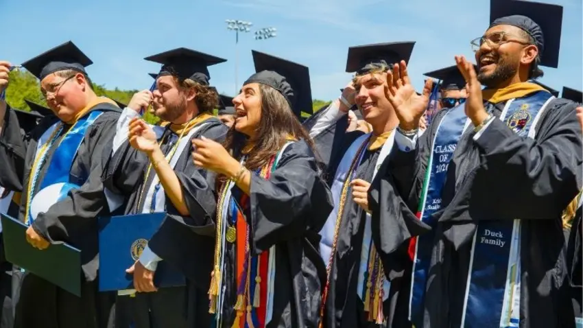 Bentley Class of 2026 graduates celebrate at the end of commencement