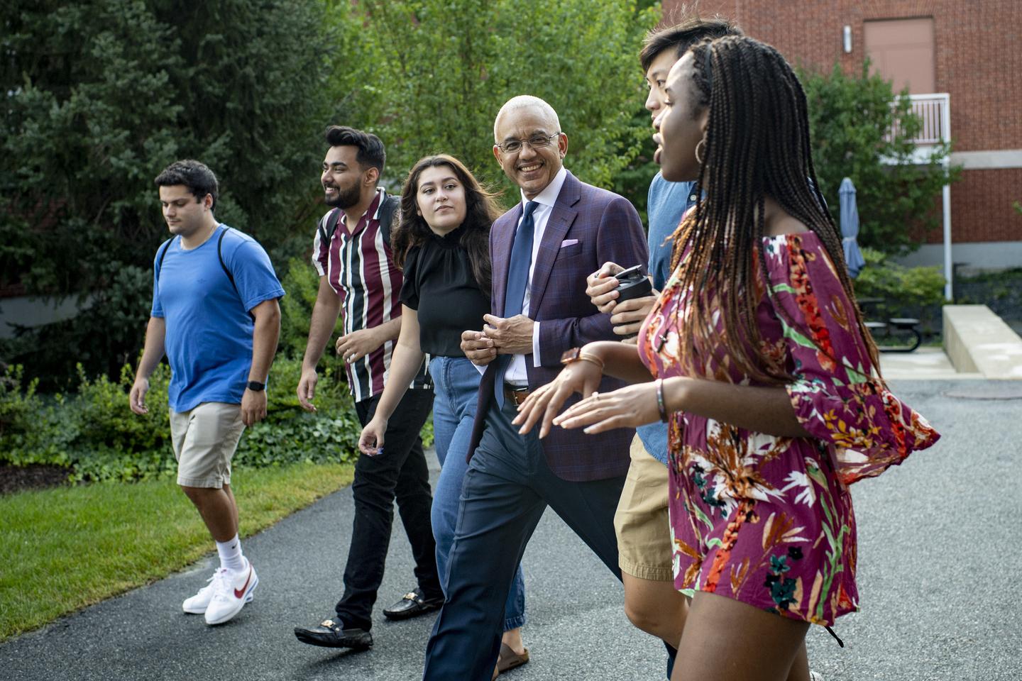 Bentley University President E. LaBrent Chrite walks with students