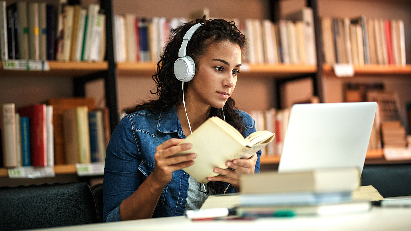 Female studying with earphones
