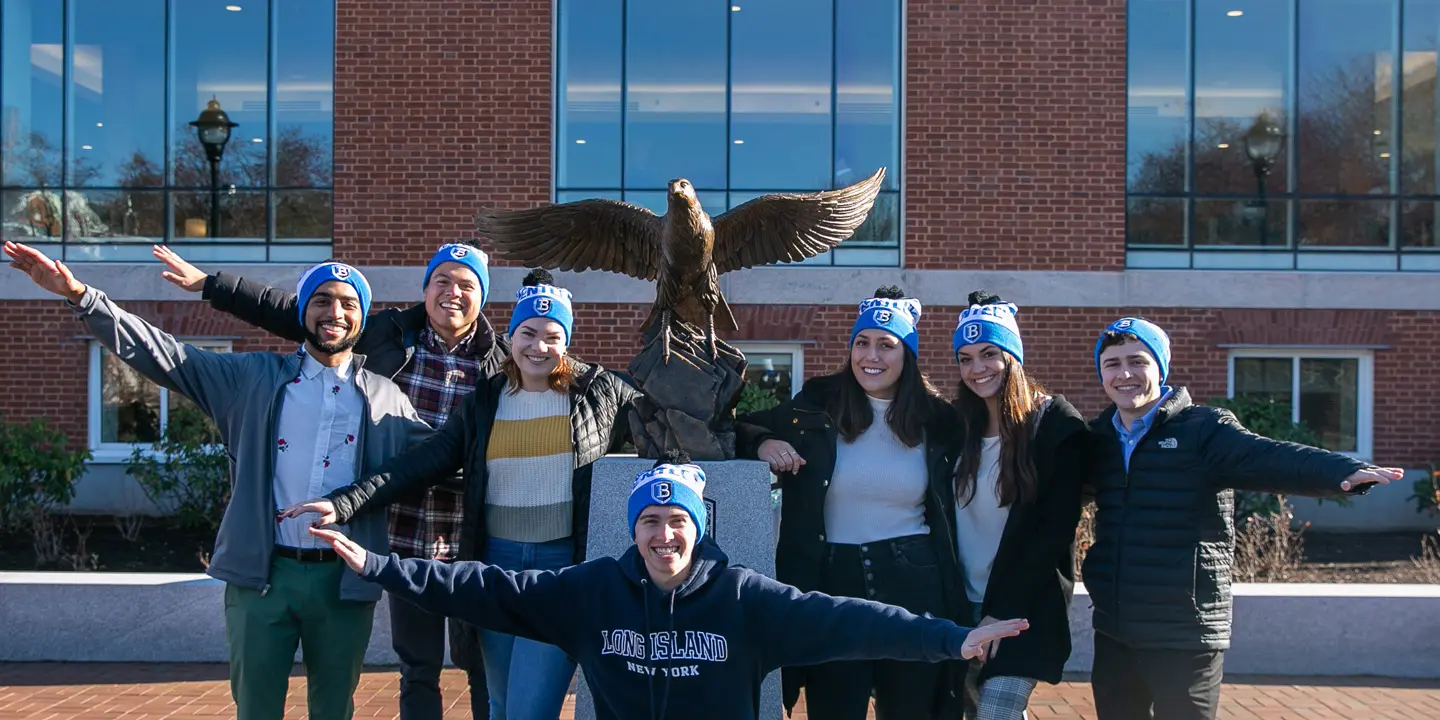 group of students at Falcon statue