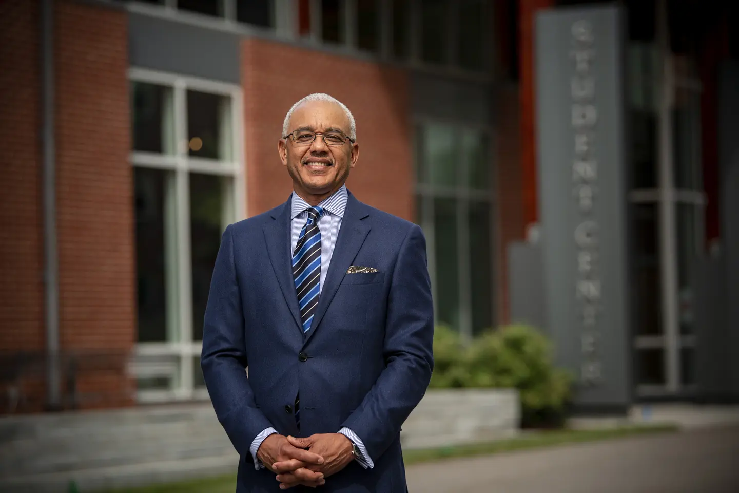 President Chrite in front of the student center