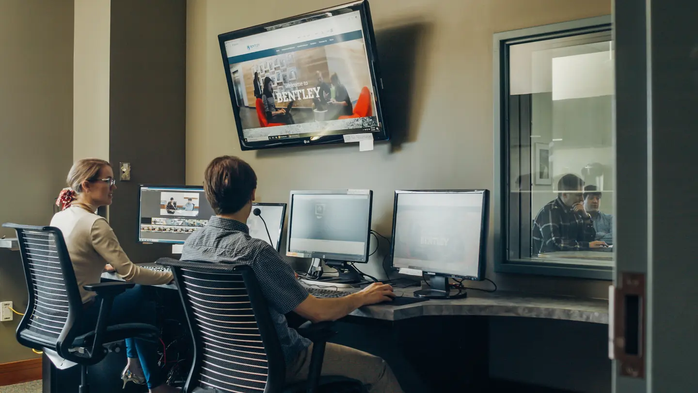 uxc lab at bentley university with two students 