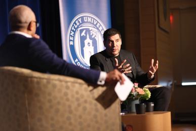 President Chrite and Marcelo Claure '93 sitting in chairs talking