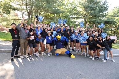 Bentley orientation leaders and resident assistants with Flex the Falcon mascot