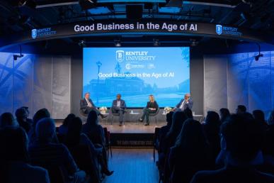 Bentley President E. LaBrent Chrite sits with panelists Dan Farley MBA ’95, Jane Steinmetz and Corey E. Thomas on stage at Bentley Gallup AI event