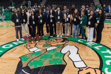 Participants in Celtics Career Day, presented by Bentley University, gather on the court at TD Gardenrden