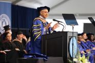 President Chrite speaks at the podium at the 2022 Commencement 
