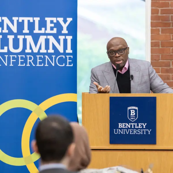 Marvin speaking at the Bentley Alumni Conference
