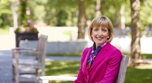 Bentley University President Alison Davis-Blake on a bench 